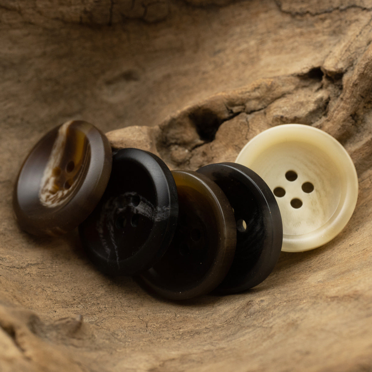Dark resin buttons with marbled accents, round 4-hole design