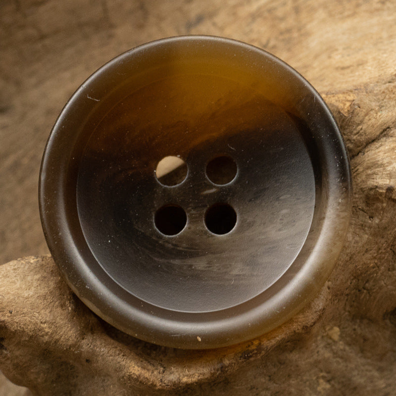 Coffee-brown resin button, round with four holes