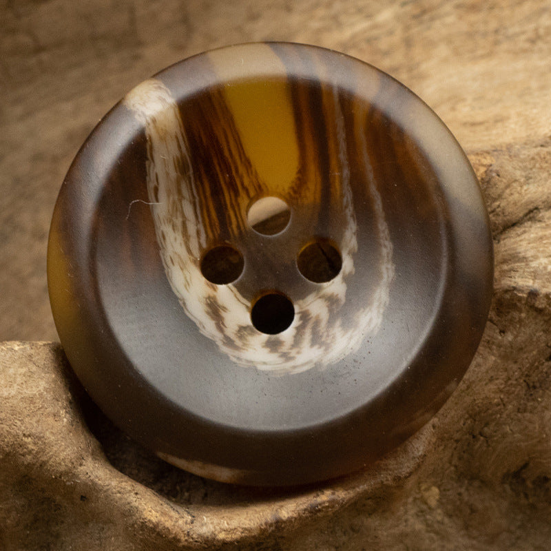 Tortoiseshell resin button, round 4-hole with warm stripe pattern