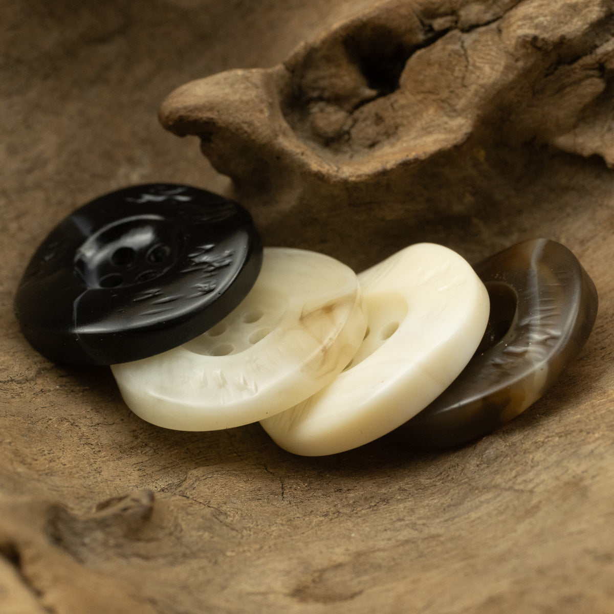 Irregular curved resin buttons, thickened, black and cream, 4-hole