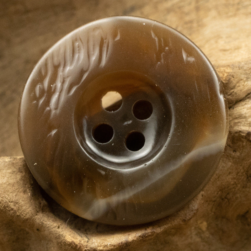 Brown resin button, thickened irregular curved shape, 4-hole, embossed pattern
