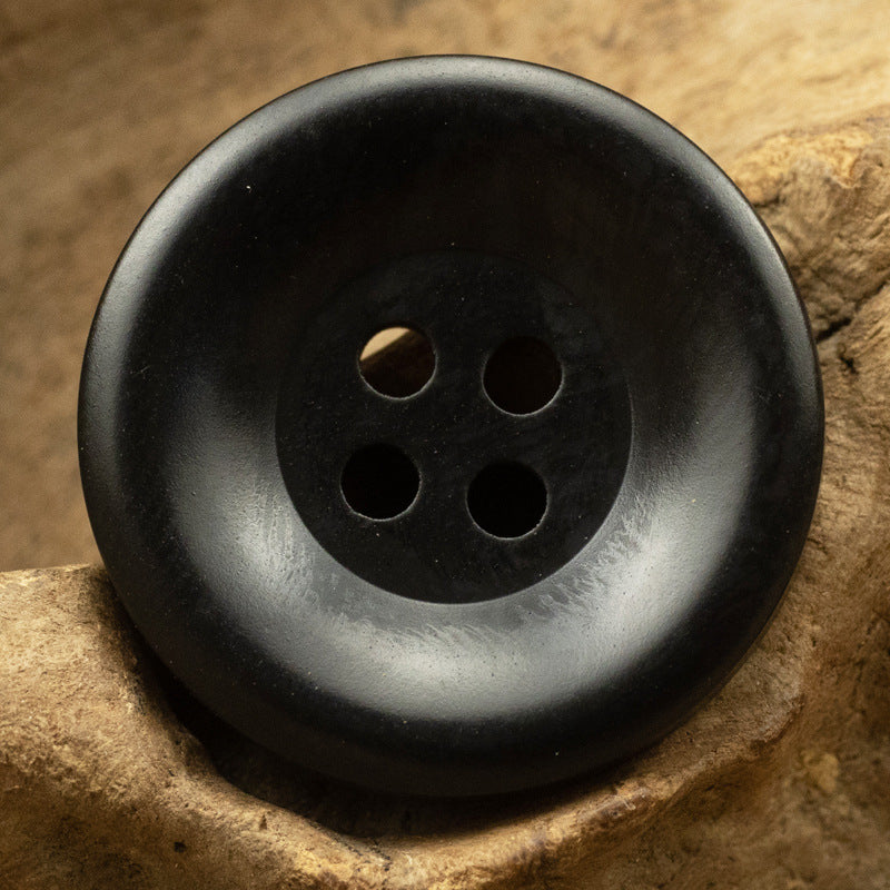 Resin button, black, wide edge, four-hole front