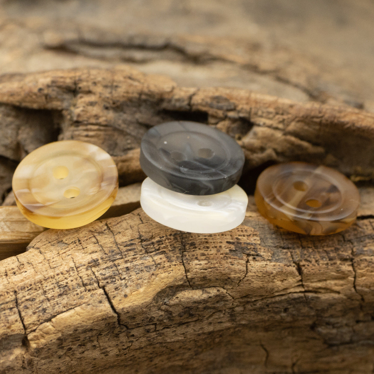 Assorted resin 2-hole buttons—white, gray, pale yellow, and brown tones