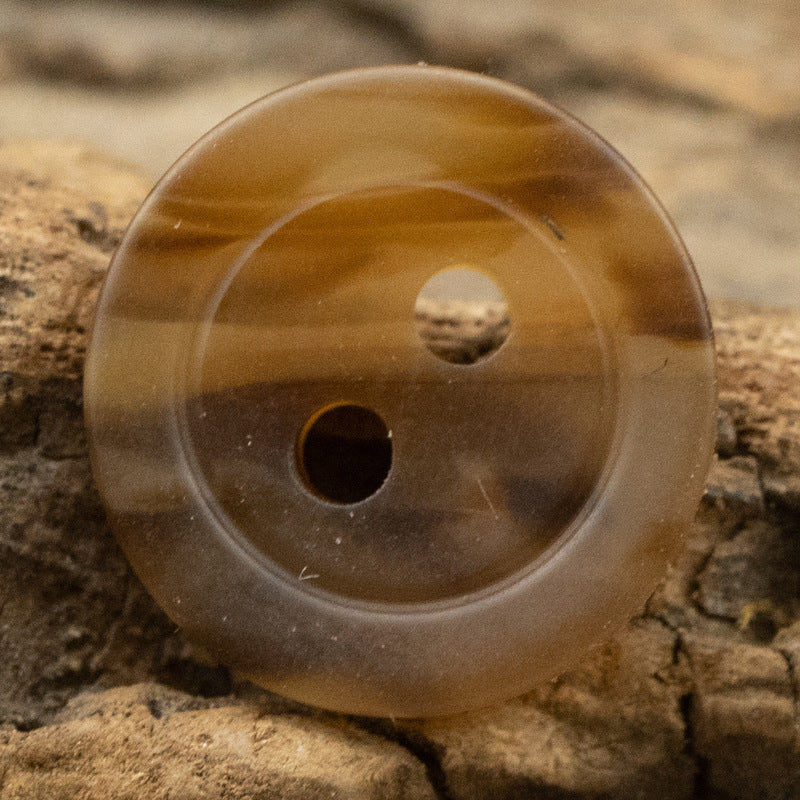 Amber 2-hole resin button, 11.5mm, close-up front with two holes