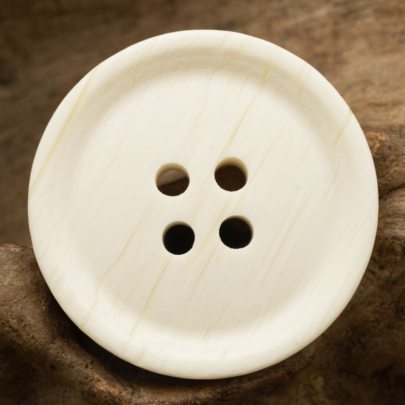 Round white resin buttons with 4 holes and subtle ox-bone grain texture