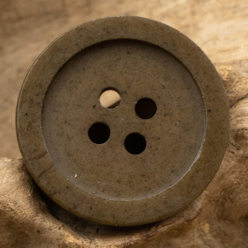 Distressed brown resin button, wide edge, 4 holes, front view (15–25mm)