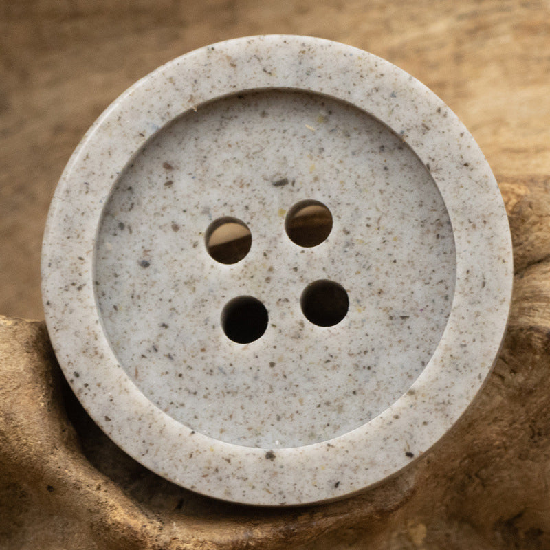 Distressed cement gray resin button, wide edge, 4-hole front view (15–25mm)