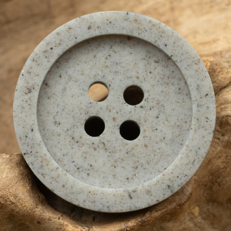 Distressed cement gray resin button with wide edge, 4-hole front view (15–25mm)