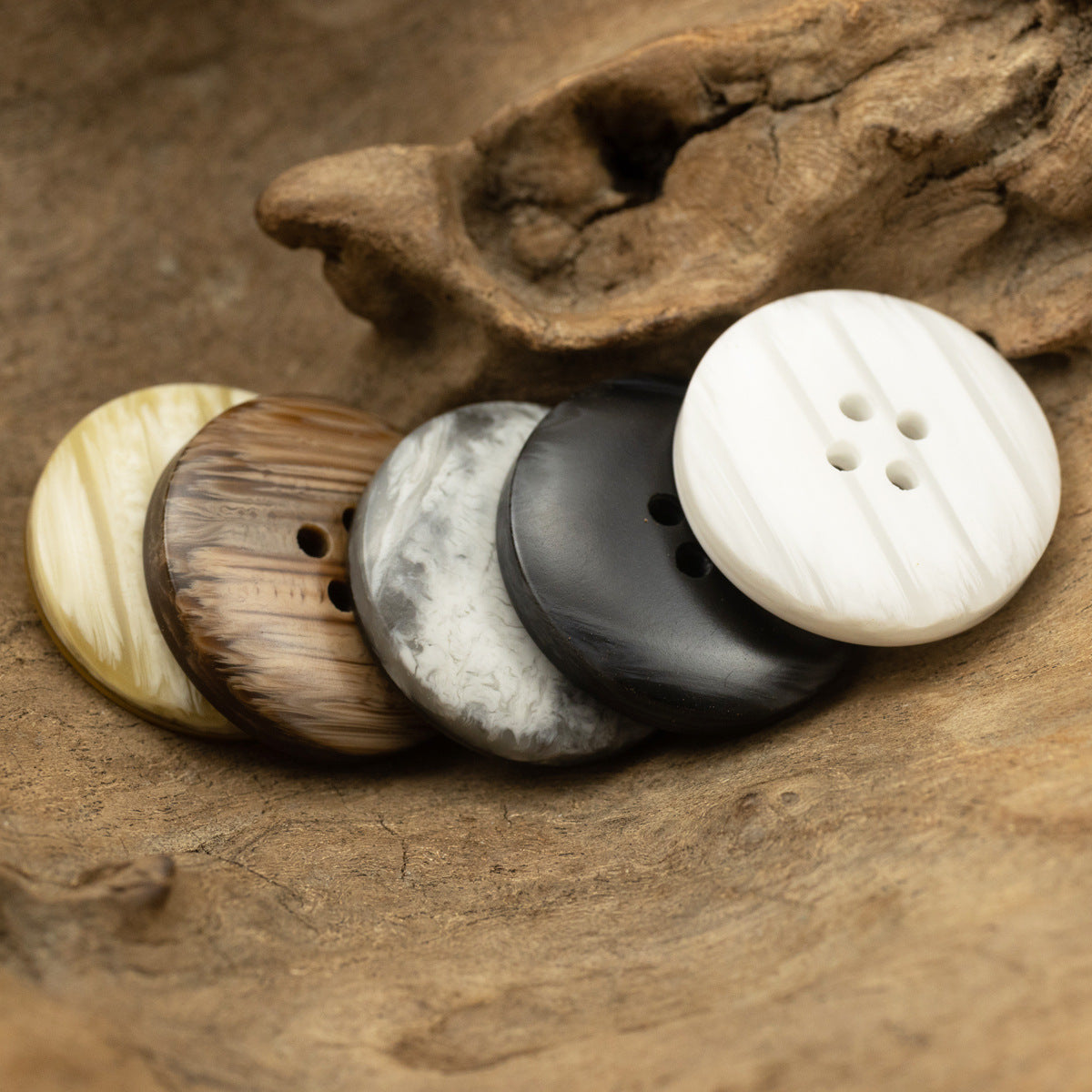 Mixed round resin buttons with 4 holes: yellow, brown wood-grain, gray, and white
