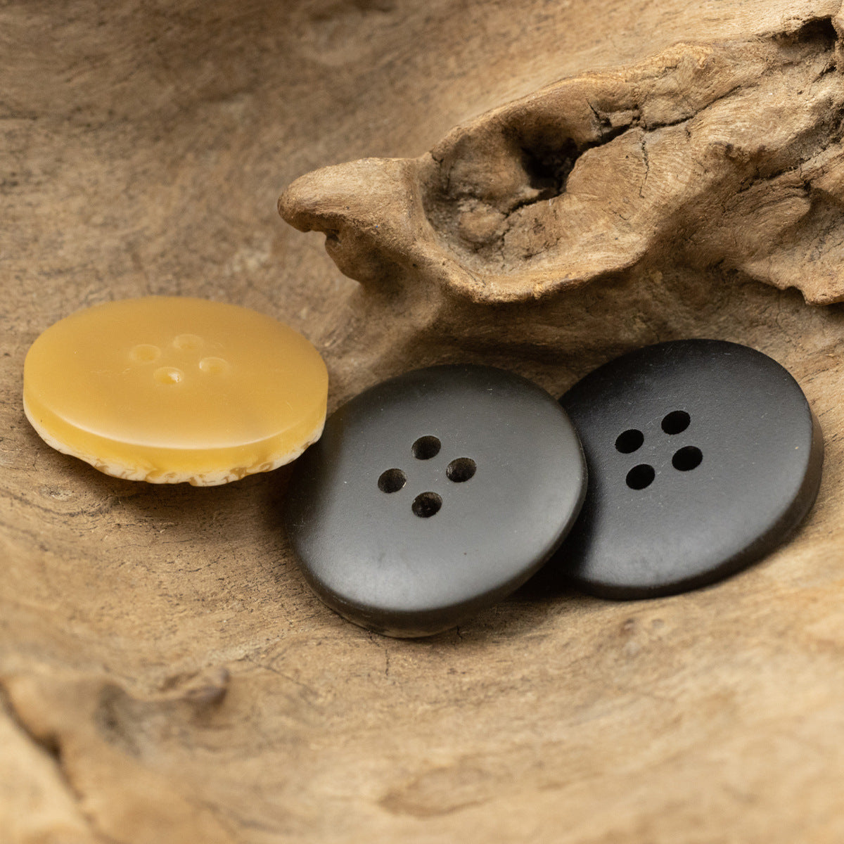 Irregular resin buttons in yellow and dark gray, faux tree-bark texture with 4 holes