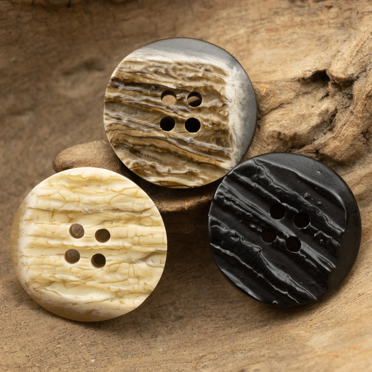Irregular resin buttons, assorted: light yellow, coffee brown, and dark charcoal with bark texture