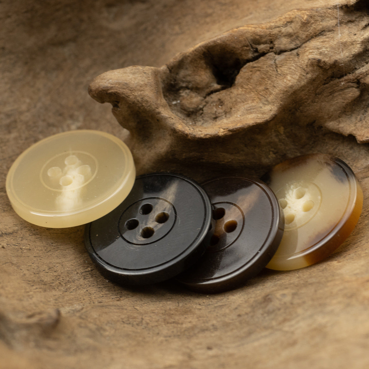 Mixed resin buttons: light yellow, dark gray, chocolate tones, 4-hole design