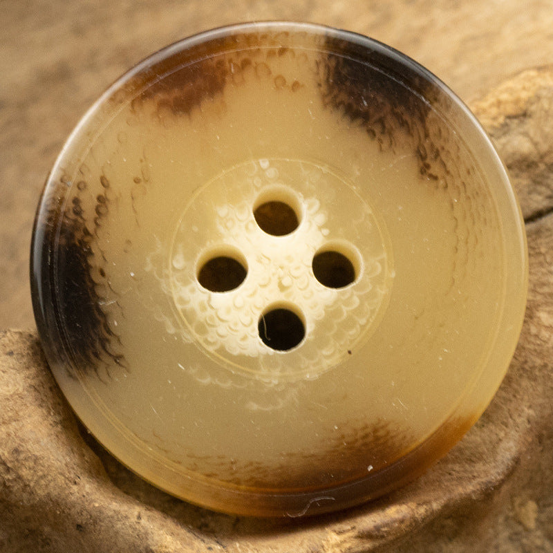 Yellow imitation resin button, 4-hole design with marbled speckle