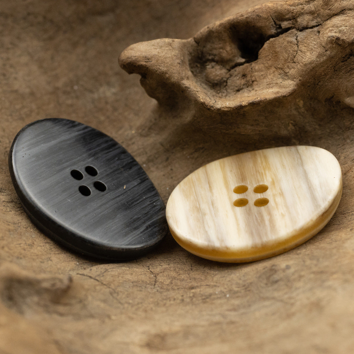 Black and cream large irregular oval resin buttons with wood-grain look, 4 holes