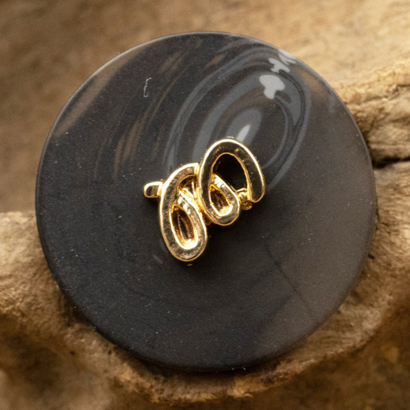 Resin-Metallknopf in Schwarz, goldfarbene 2-Loch-Schlaufe