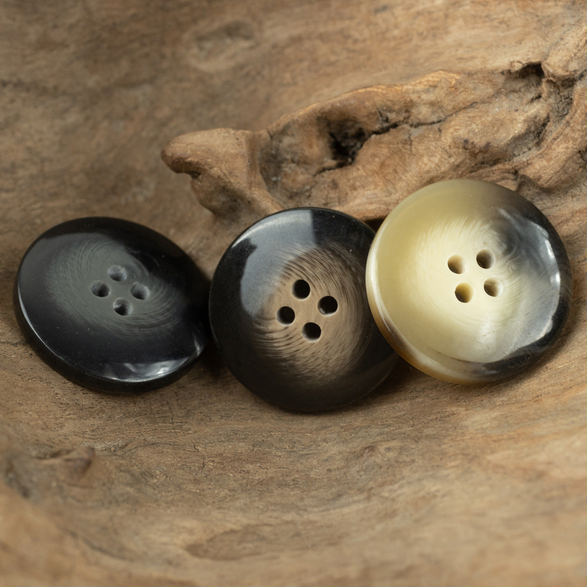 Resin buttons with 4 holes in black, gray-brown, and light khaki shades