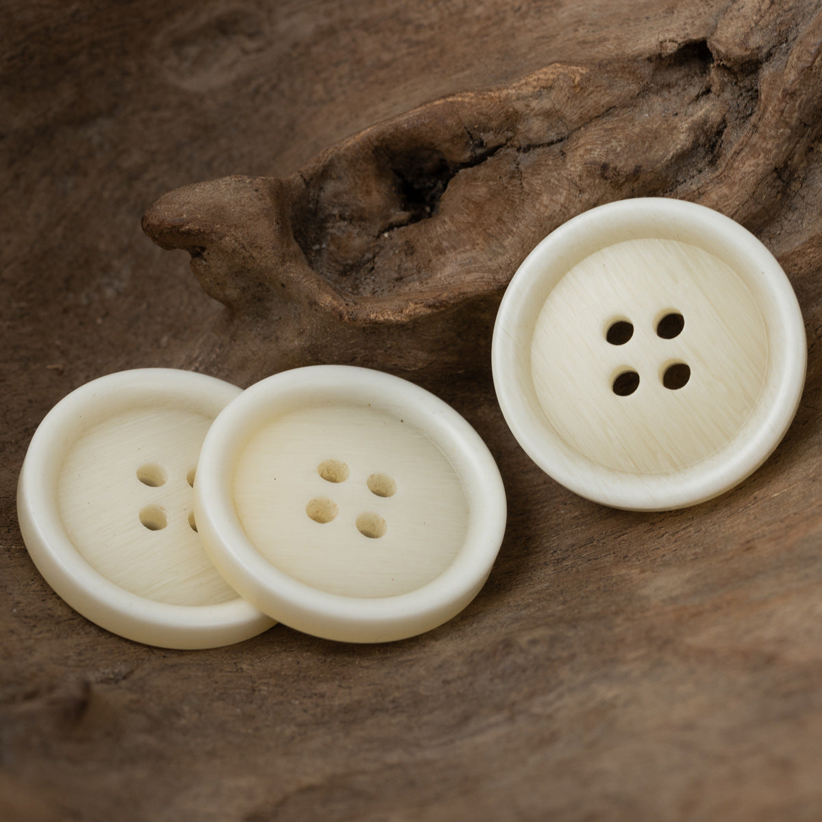 Light beige woodgrain resin buttons, 4-hole, multiple front angles