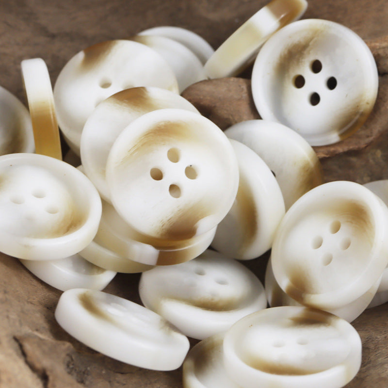 Ivory resin 4-hole buttons with warm beige marbling, round flat, four sew holes