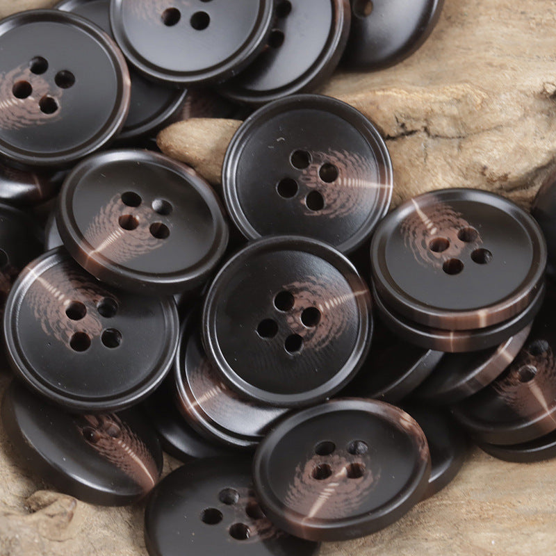 Round resin 4-hole buttons with dark finish and four holes for sewing