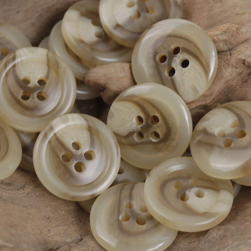 Creamy light khaki resin buttons, round 4-hole, glossy mottled finish