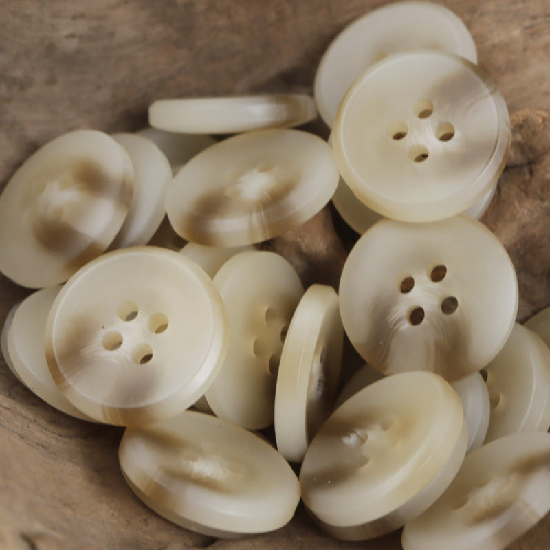 Cream resin buttons, round 4-hole, mixed tones in a 30-pack