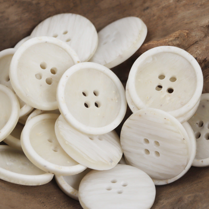 Four-hole resin buttons, white wood-chip texture, round button with four holes