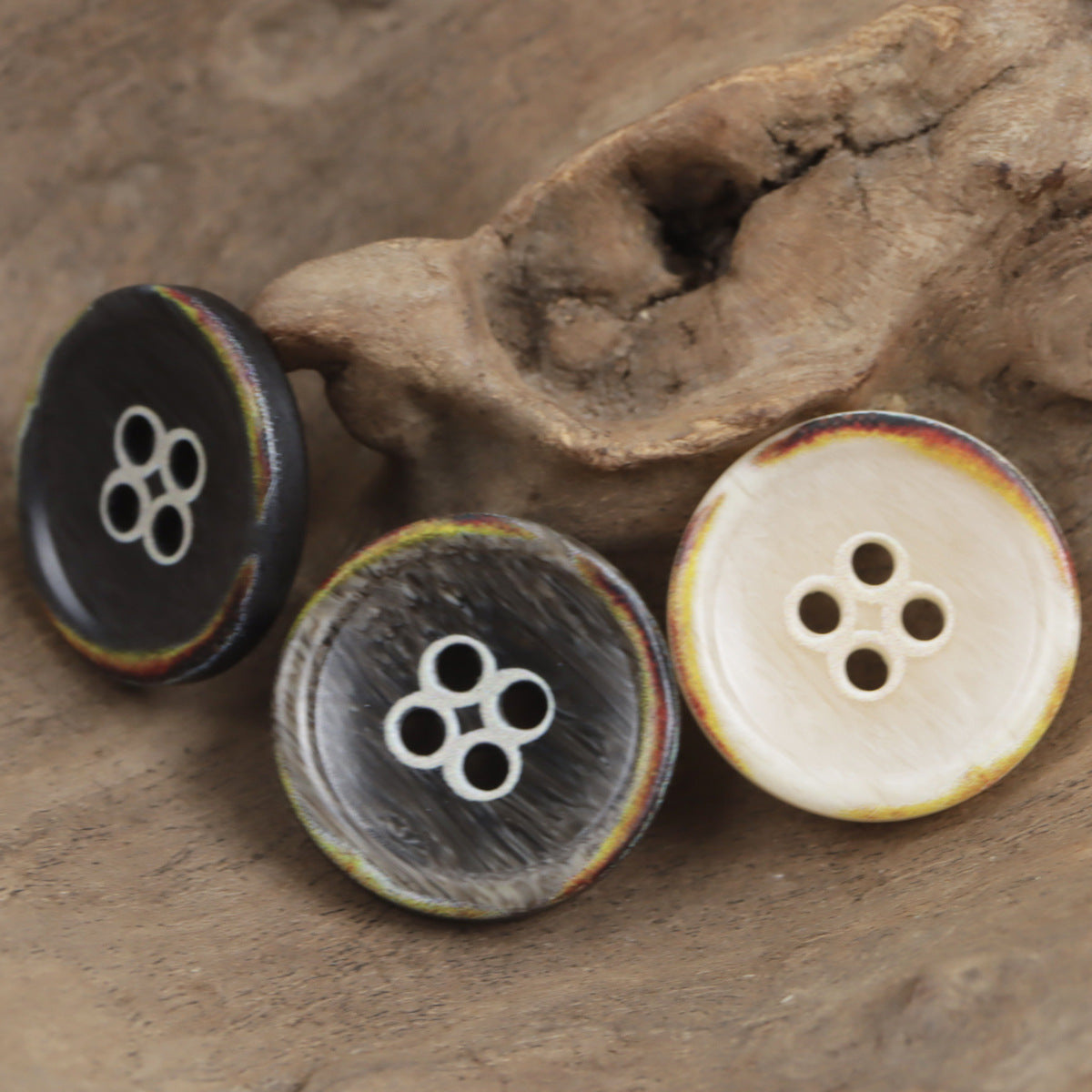 4-hole round resin buttons in dark and beige, flower-shaped hole pattern