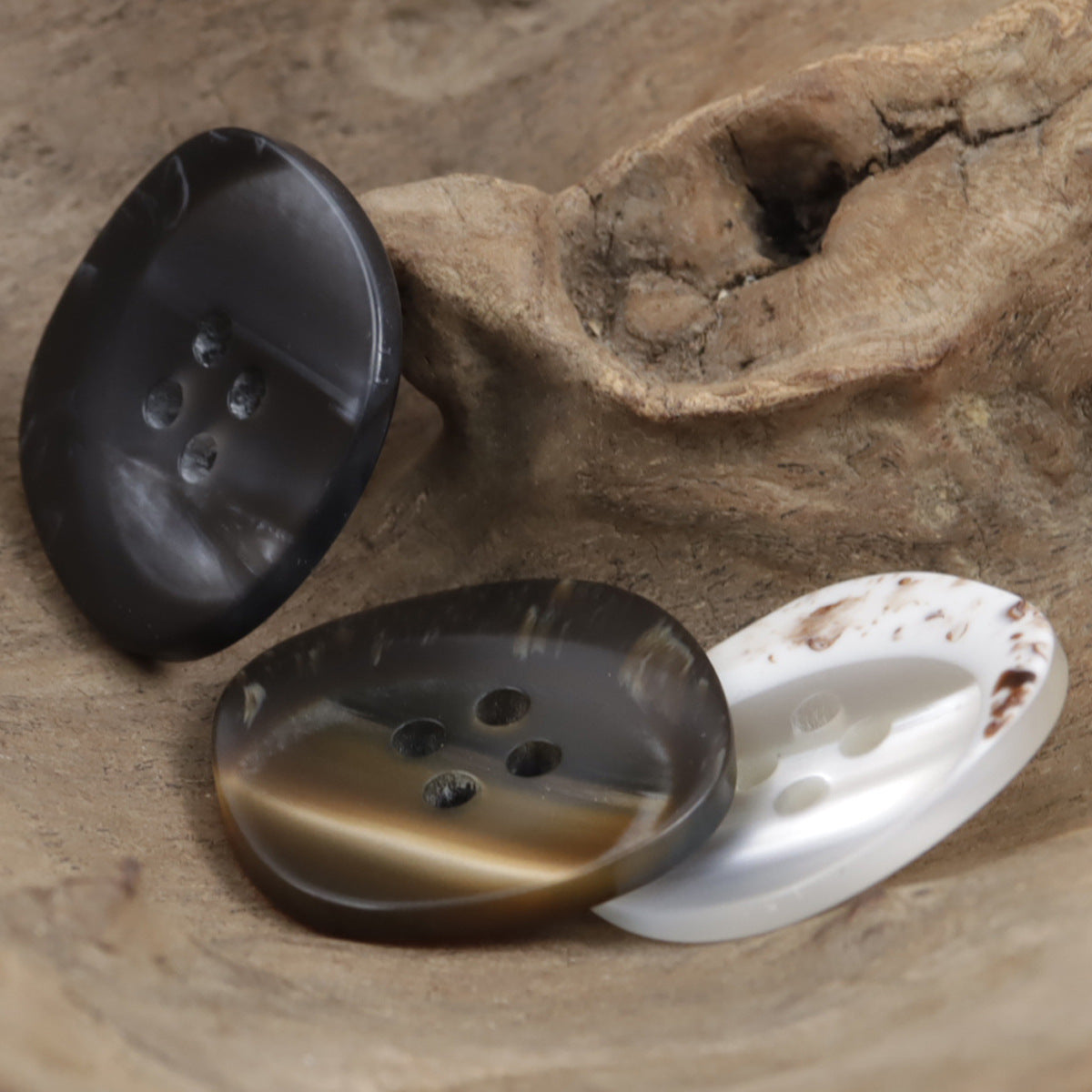 Coffee and black resin buttons, round with 4 holes