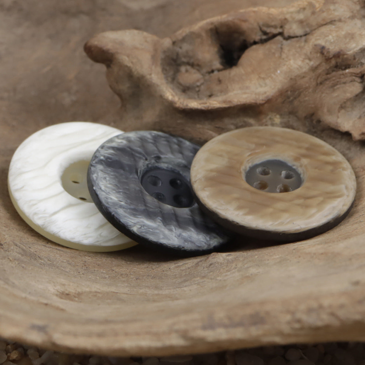 Resin buttons in white and dark, plus light brown, round 4-hole design