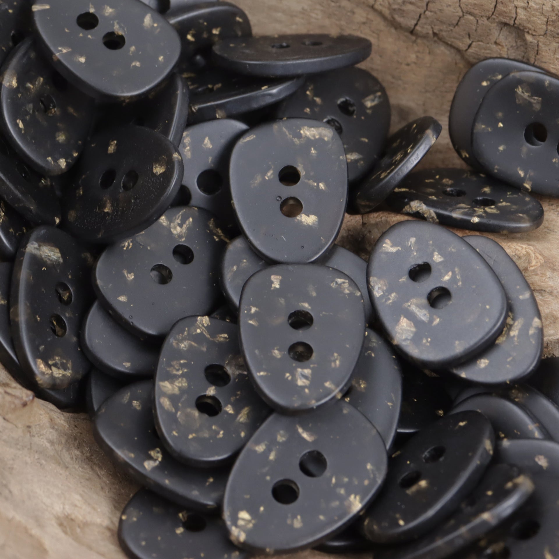 Black oval resin buttons with gold foil speckle, mix of 2-hole angles