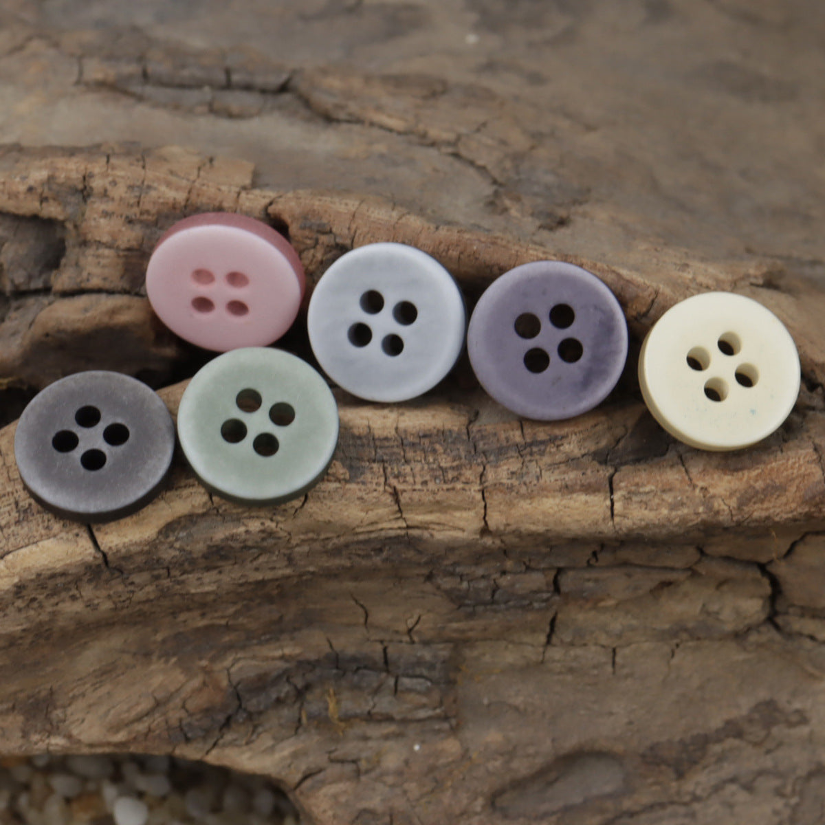 Assorted 4-hole resin shirt buttons: pale pink, light blue-gray, lavender, sage, dark gray, cream