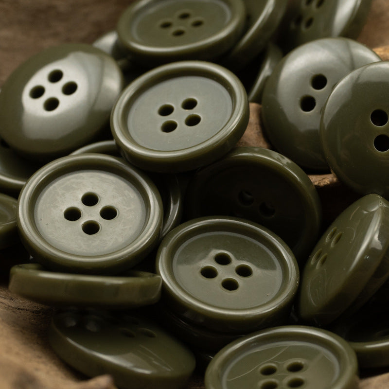 Round four-hole resin buttons in olive green and muted gray tones