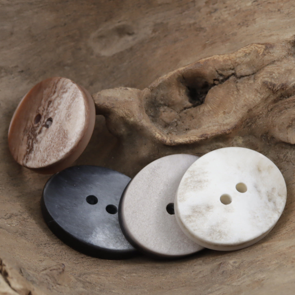 Oval 2-hole resin buttons with marble look: pale white, dark gray, and warm brown