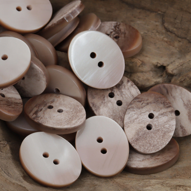 Mixed oval resin buttons with two holes in tan, brown, and light beige marble