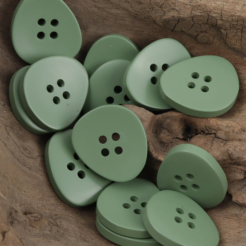 Irregular 4-hole resin buttons, soft green set with four holes