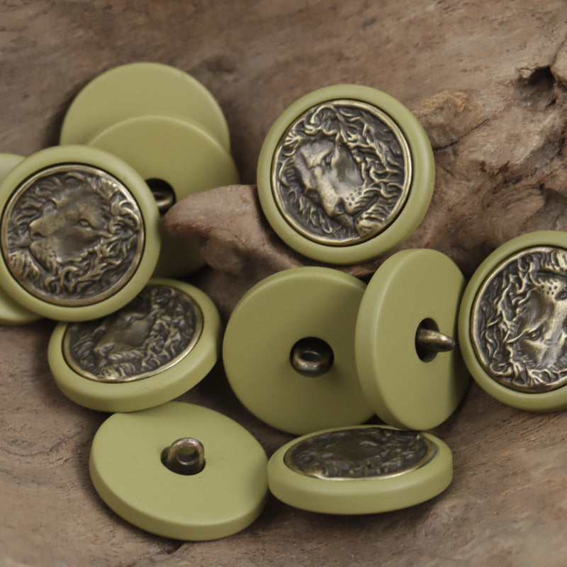 Round resin buttons in khaki-green with bronze lion medallion front, button shank