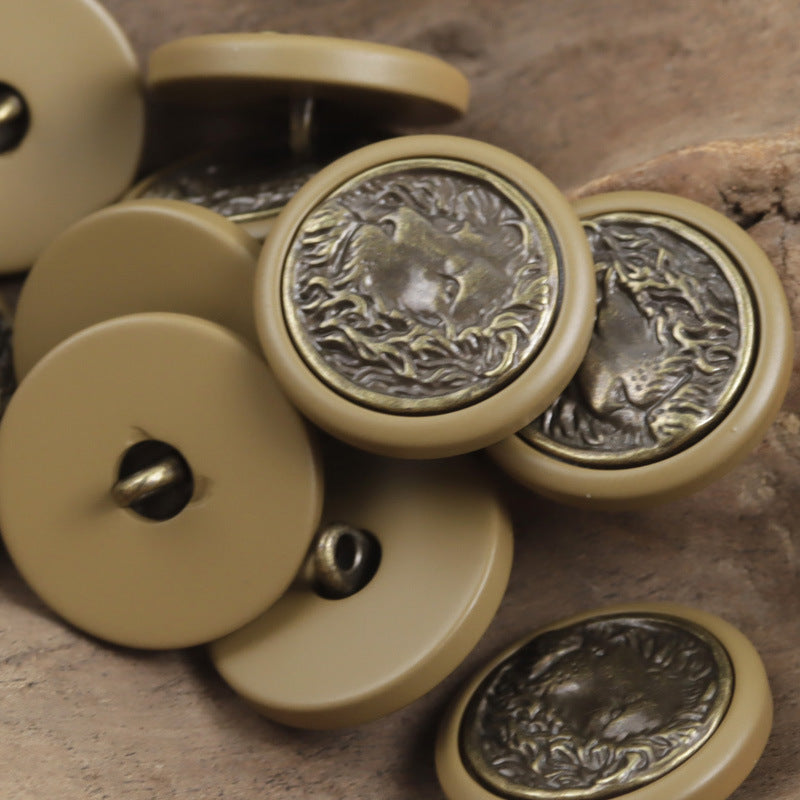 Round resin buttons in khaki/beige tones, bronze lion medallion with metal-look rim