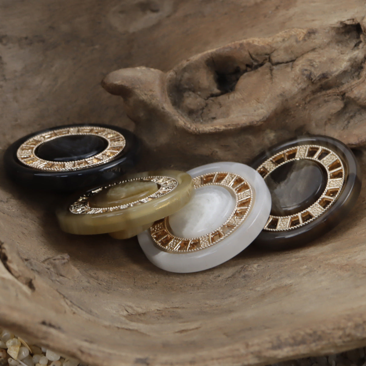 Assorted round resin buttons with antique gold-tone chessboard trim and jeweled edge