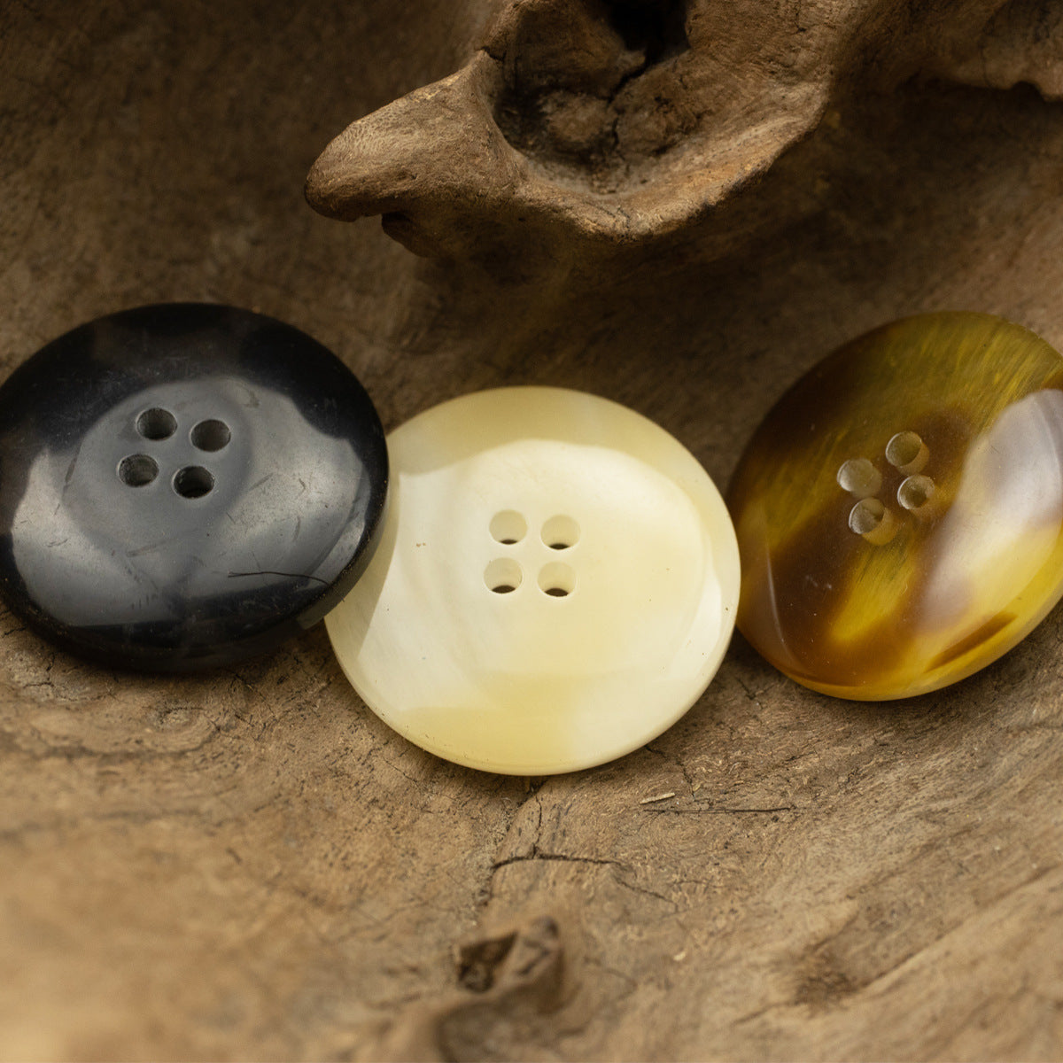 Resin buttons, 4-hole rounds in black, cream and coffee tones