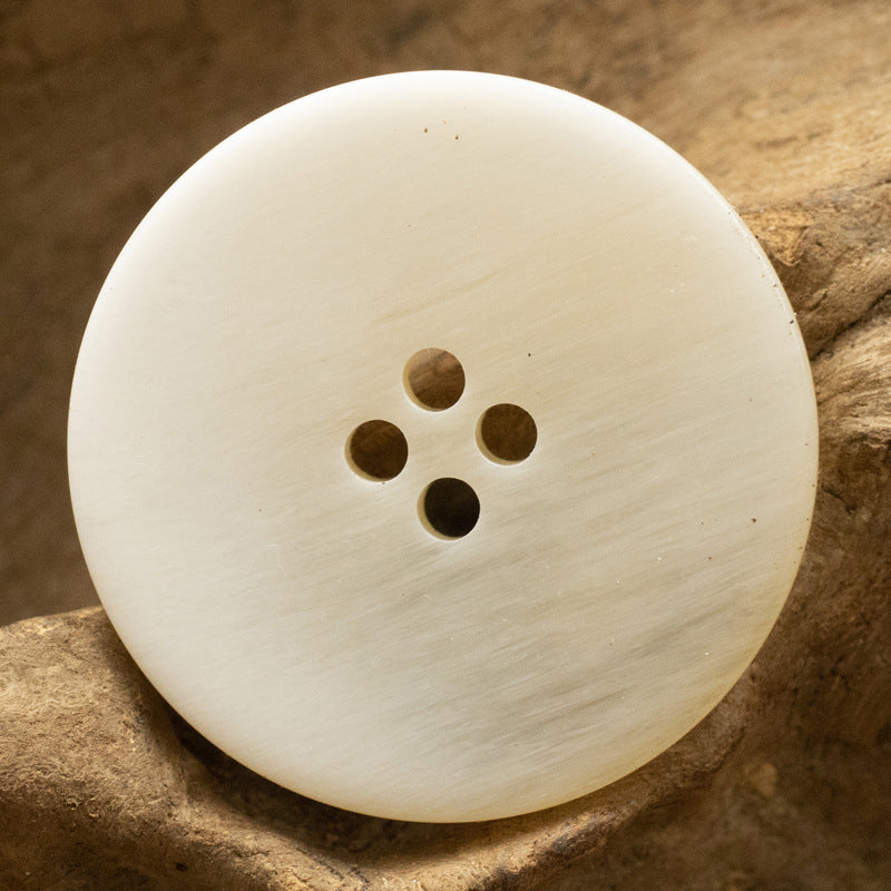 Cream resin button, amber-look gradient, 4 holes, round
