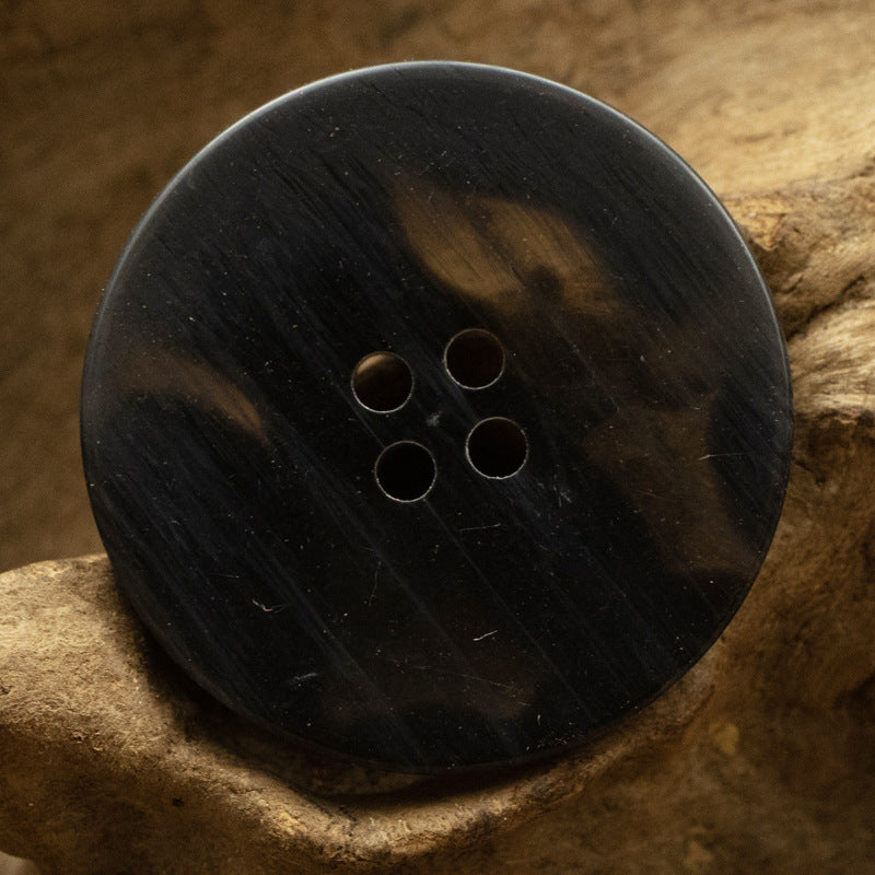 Black resin button, gradient pattern, 4 holes, round