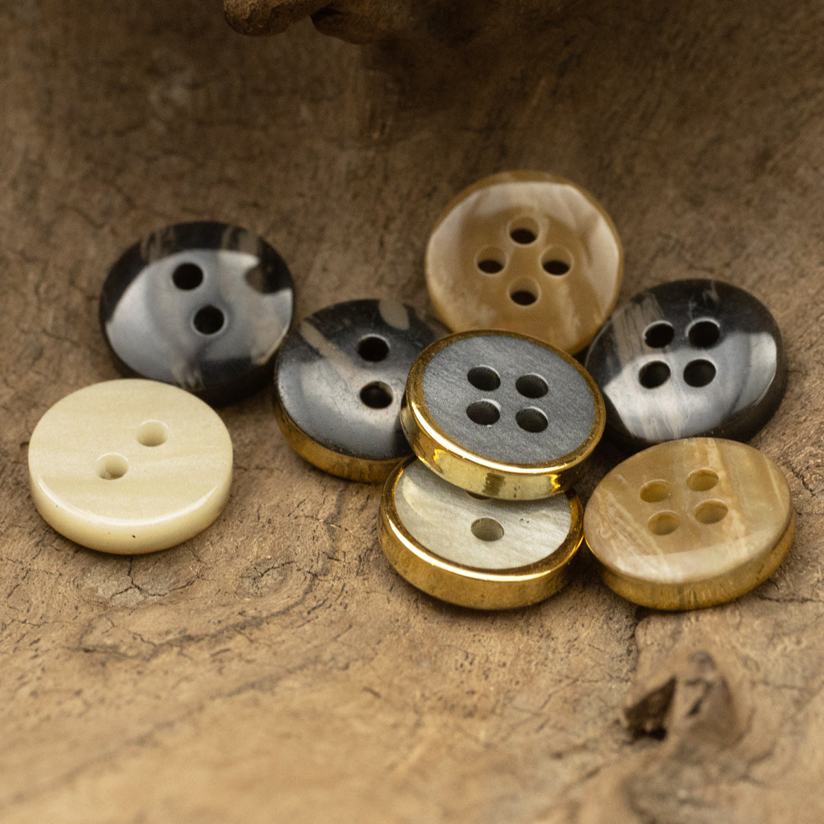 Wood-grain resin button group with gold edge trim, gray and cream, four-hole