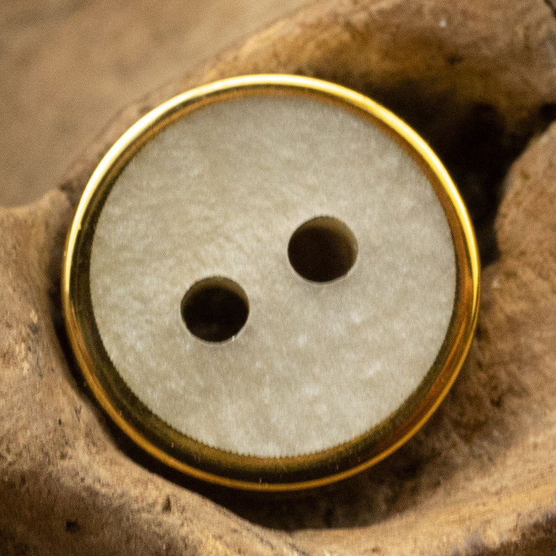 Light gray wood-grain resin button with gold rim, two-hole face