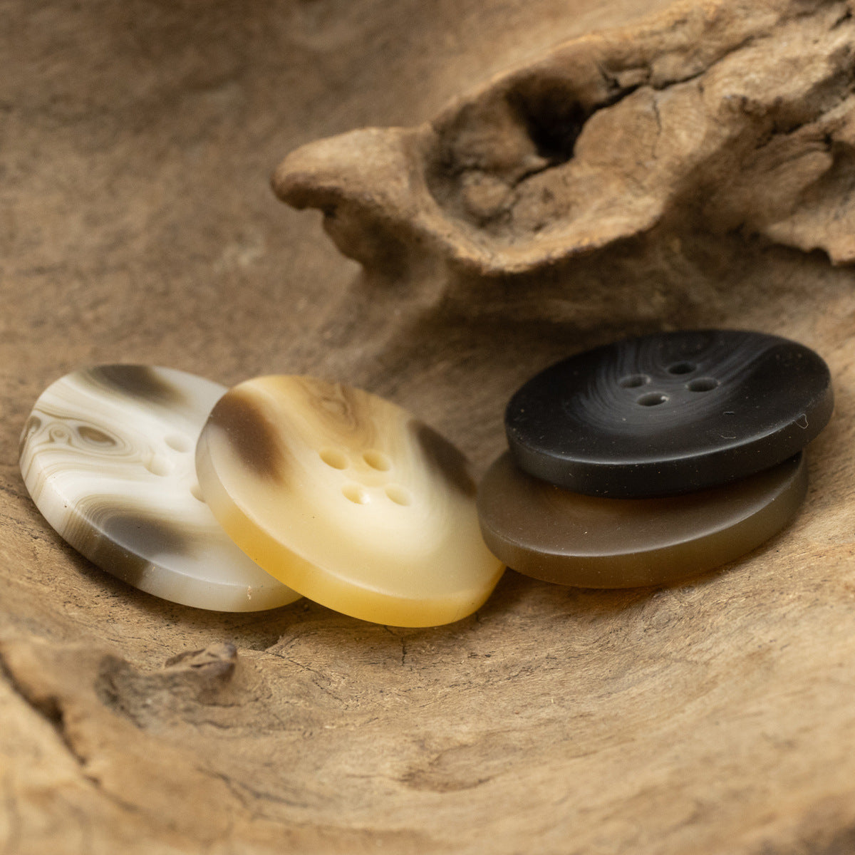 Set of four-hole resin buttons in light, tan, and dark brown shades