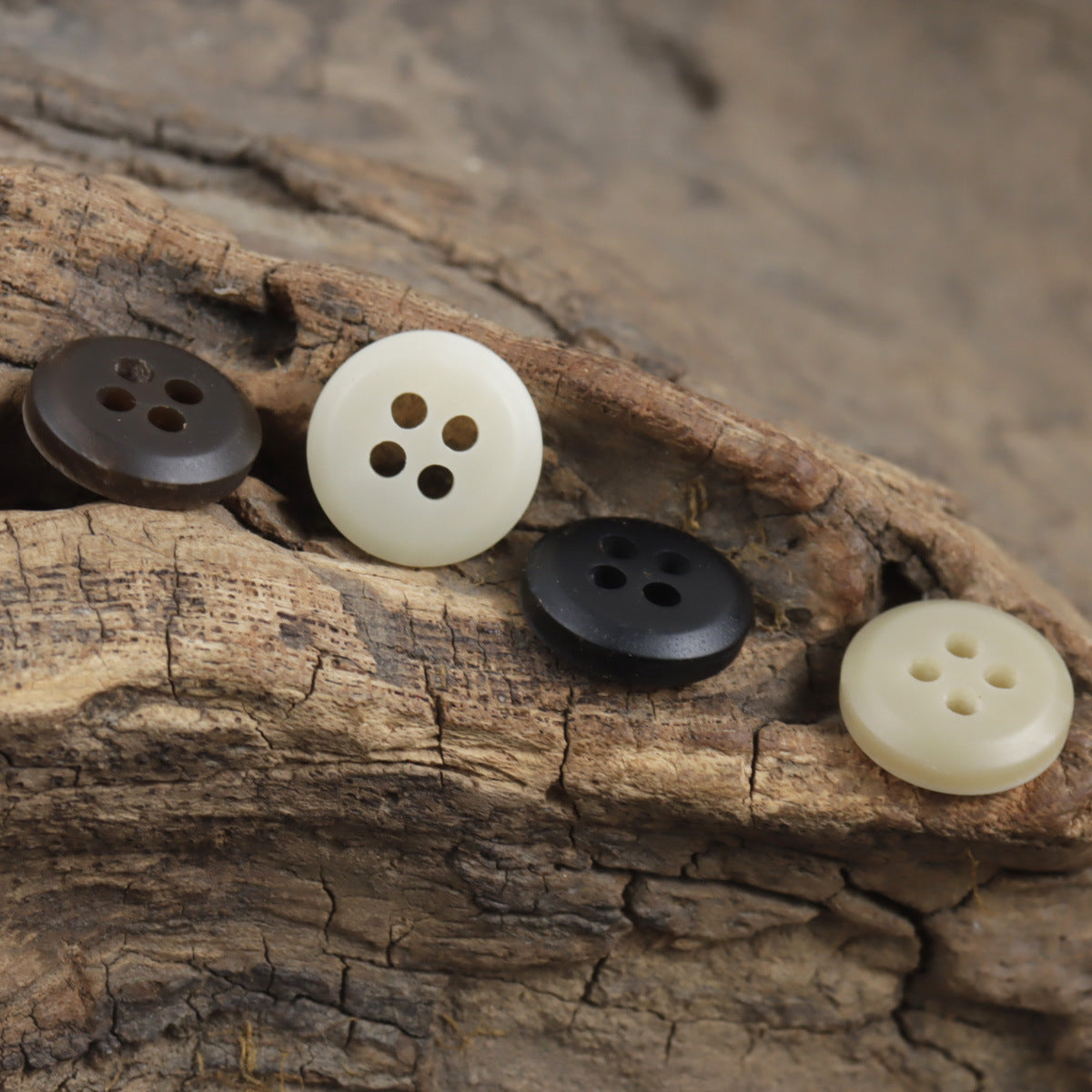Assorted resin buttons: white, tan, and dark gray-black, 4-hole