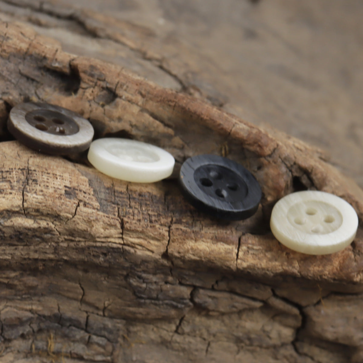 Mixed resin buttons in dark gray and ivory, 4-hole design