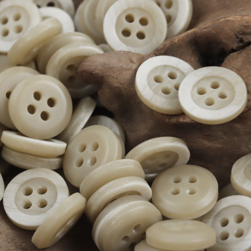 Light tan resin buttons with wood-grain edge, 4-hole