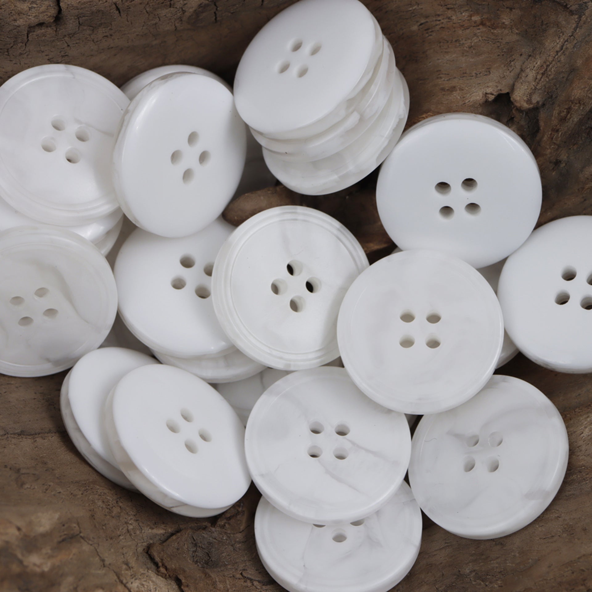 White resin buttons, round with 4 holes, stacked set