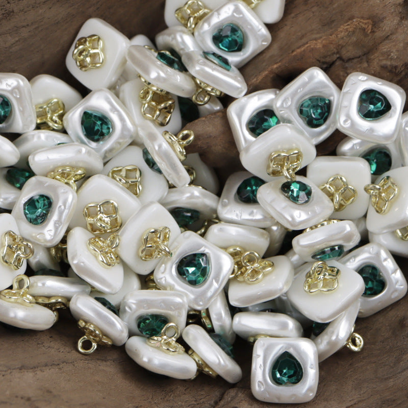 Resin button, square-heart face, green jeweled center, metal shank