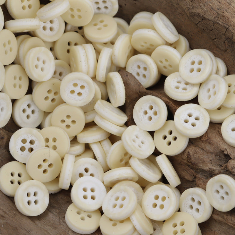 Cream resin four-hole buttons with two-tone pebble pattern, mixed pile